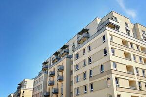 Modern and new apartment building. Multistoried, modern, new and stylish living block of flats. photo