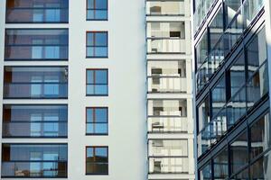 Modern and new apartment building. Multistoried, modern, new and stylish living block of flats. photo