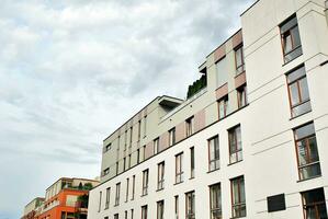 Modern and new apartment building. Multistoried, modern, new and stylish living block of flats. photo