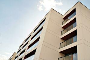 Modern and new apartment building. Multistoried, modern, new and stylish living block of flats. photo