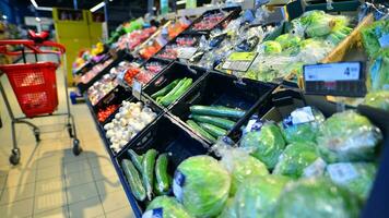 Warsaw, Poland. 8 January 2024. Supermarket store aisle with products filling shelves. Carrefour supermarket. photo