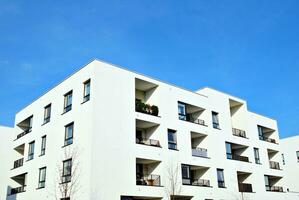 Modern and new apartment building. Multistoried, modern, new and stylish living block of flats. photo