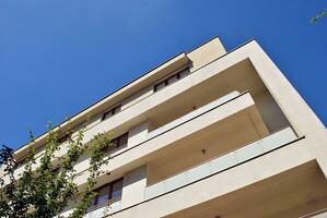 Modern and new apartment building. Multistoried, modern, new and stylish living block of flats. photo