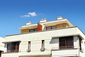 Modern and new apartment building. Multistoried, modern, new and stylish living block of flats. photo