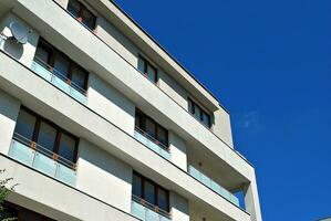 Modern and new apartment building. Multistoried, modern, new and stylish living block of flats. photo