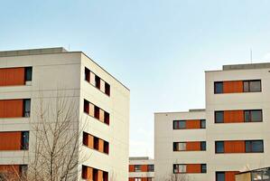 Modern and new apartment building. Multistoried, modern, new and stylish living block of flats. photo