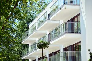 Modern and new apartment building. Multistoried, modern, new and stylish living block of flats. photo