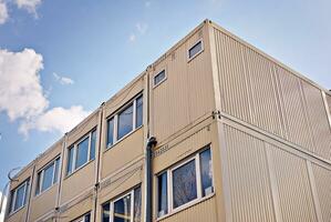 Modern and new apartment building. Multistoried, modern, new and stylish living block of flats. photo