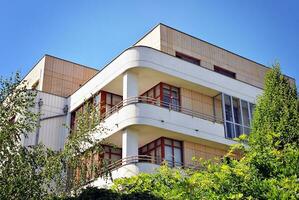 Modern and new apartment building. Multistoried, modern, new and stylish living block of flats. photo