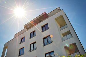 Modern and new apartment building. Multistoried, modern, new and stylish living block of flats. photo