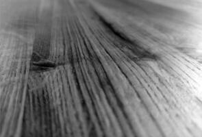 Natural wood black and white background with blurred elements photo