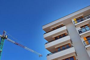 Modern and new apartment building. Multistoried, modern, new and stylish living block of flats. photo