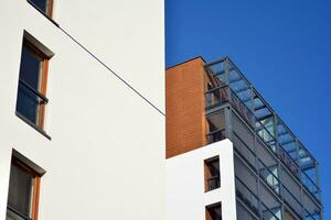 Modern and new apartment building. Multistoried, modern, new and stylish living block of flats. photo