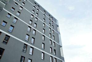 Modern and new apartment building. Multistoried, modern, new and stylish living block of flats. photo