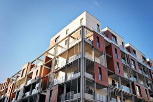 Modern and new apartment building. Multistoried, modern, new and stylish living block of flats. photo