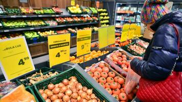Warsaw, Poland. 8 January 2024. Inside supermarket Netto. Fresh fruits and vegetables. photo
