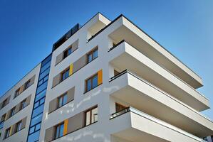 Modern and new apartment building. Multistoried, modern, new and stylish living block of flats. photo