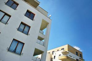 Modern and new apartment building. Multistoried, modern, new and stylish living block of flats. photo