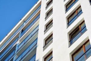 Modern and new apartment building. Multistoried, modern, new and stylish living block of flats. photo