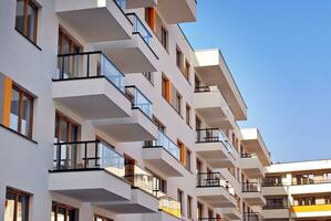 Modern and new apartment building. Multistoried, modern, new and stylish living block of flats. photo