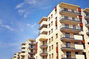 Modern and new apartment building. Multistoried, modern, new and stylish living block of flats. photo