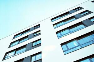 Modern and new apartment building. Multistoried, modern, new and stylish living block of flats. photo