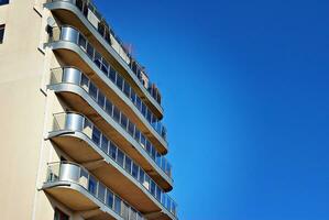 Modern and new apartment building. Multistoried, modern, new and stylish living block of flats. photo