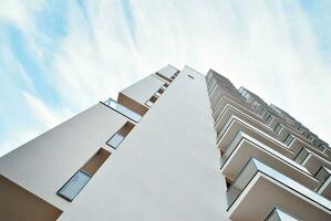 Modern and new apartment building. Multistoried, modern, new and stylish living block of flats. photo