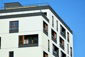 Modern and new apartment building. Multistoried, modern, new and stylish living block of flats. photo