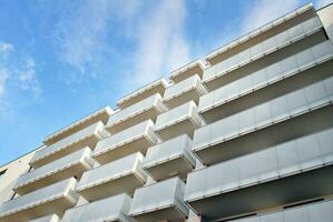 Modern and new apartment building. Multistoried, modern, new and stylish living block of flats. photo