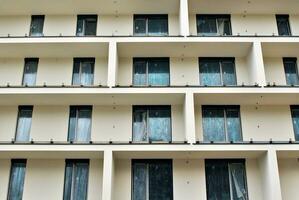 Modern and new apartment building. Multistoried, modern, new and stylish living block of flats. photo