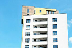 Modern and new apartment building. Multistoried, modern, new and stylish living block of flats. photo
