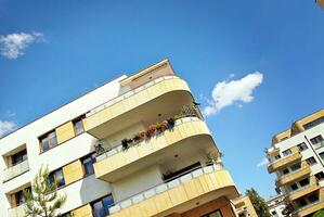 Modern and new apartment building. Multistoried, modern, new and stylish living block of flats. photo