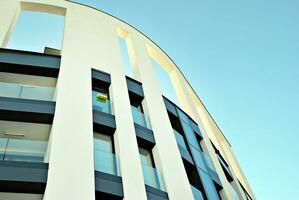 Modern and new apartment building. Multistoried, modern, new and stylish living block of flats. photo