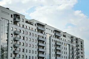 Modern and new apartment building. Multistoried, modern, new and stylish living block of flats. photo