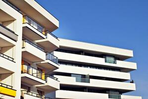 Modern and new apartment building. Multistoried, modern, new and stylish living block of flats. photo