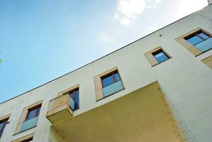 Modern and new apartment building. Multistoried, modern, new and stylish living block of flats. photo