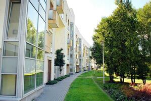 Modern and new apartment building. Multistoried, modern, new and stylish living block of flats. photo