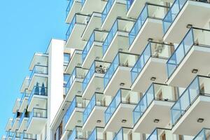 Modern and new apartment building. Multistoried, modern, new and stylish living block of flats. photo
