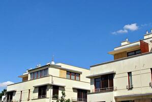 Modern and new apartment building. Multistoried, modern, new and stylish living block of flats. photo