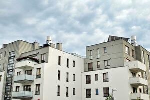 Modern and new apartment building. Multistoried, modern, new and stylish living block of flats. photo