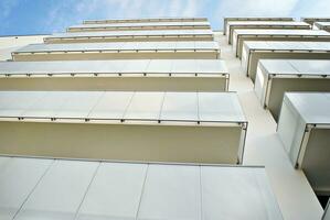 Modern and new apartment building. Multistoried, modern, new and stylish living block of flats. photo