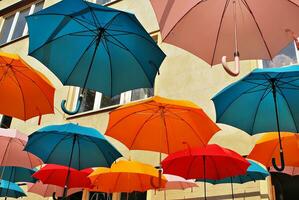 Colorful umbrellas background. Colorful umbrellas in the sky. Street decoration. photo