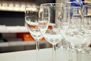 Crystal wine glasses on the table photo