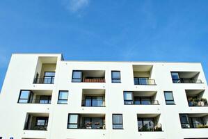 Modern and new apartment building. Multistoried, modern, new and stylish living block of flats. photo