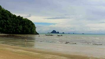 Tropical paradise turquoise water beach and limestone rocks Krabi Thailand. video