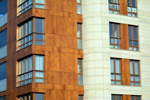 Modern and new apartment building. Multistoried, modern, new and stylish living block of flats. photo