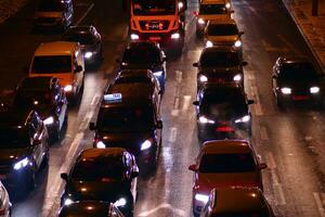 Cars on street. City street lights at night. photo