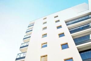 Modern and new apartment building. Multistoried, modern, new and stylish living block of flats. photo