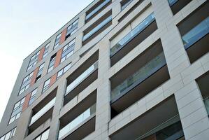 Modern and new apartment building. Multistoried, modern, new and stylish living block of flats. photo